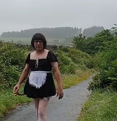 Transvestite damsel in a public lane in be transferred to rain